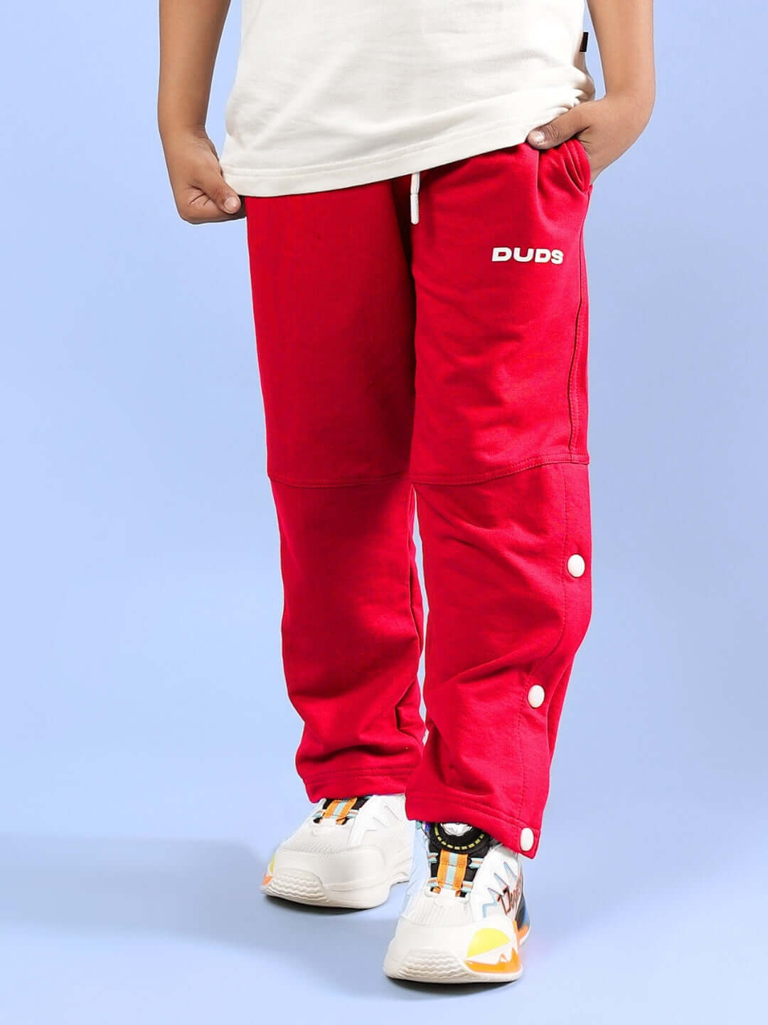 RACER JOGGER FOR BOYS & GIRLS RED from DUDS, stylish and comfortable, shown on a child model, ideal for casual wear.