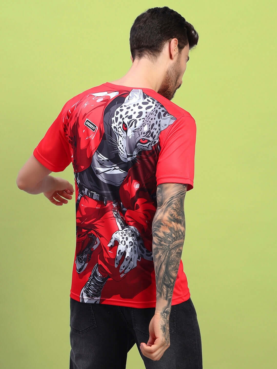 Model wearing red stylized leopard printed T-shirt with sports polyester fabric, perfect for casual outings.