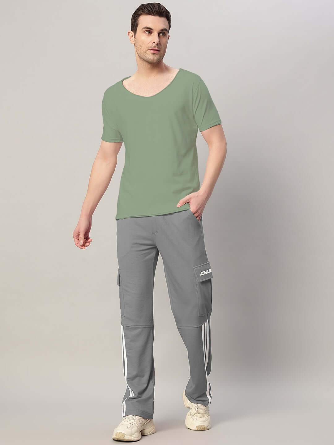 Man wearing REDROIT 5 Pocket Relaxed Fit Joggers in Grey by DUDS, showcasing casual style and comfort.