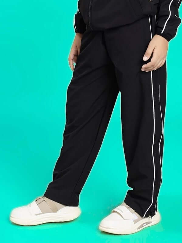 Alt Tag: RELIGHT RELAXED FIT JOGGER FOR BOYS AND GIRLS BLACK featuring a side view with white stripes and casual sneakers
