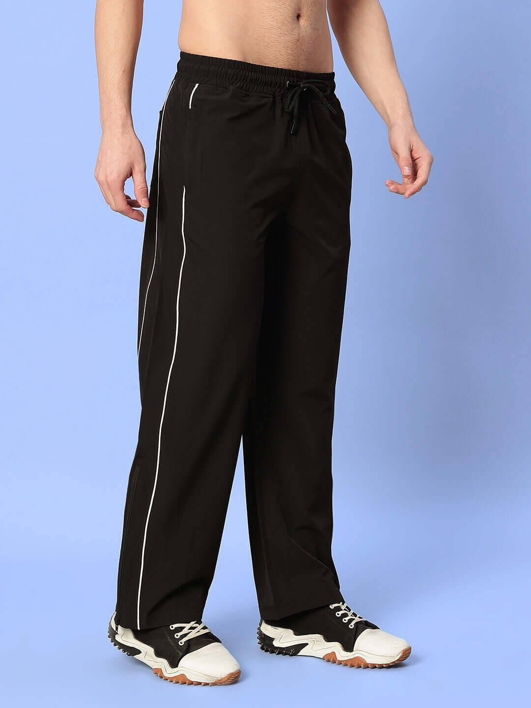 Model wearing RELIGHT Relaxed-Fit Joggers in black, featuring comfortable custom fit option and stylish design for casual wear.
