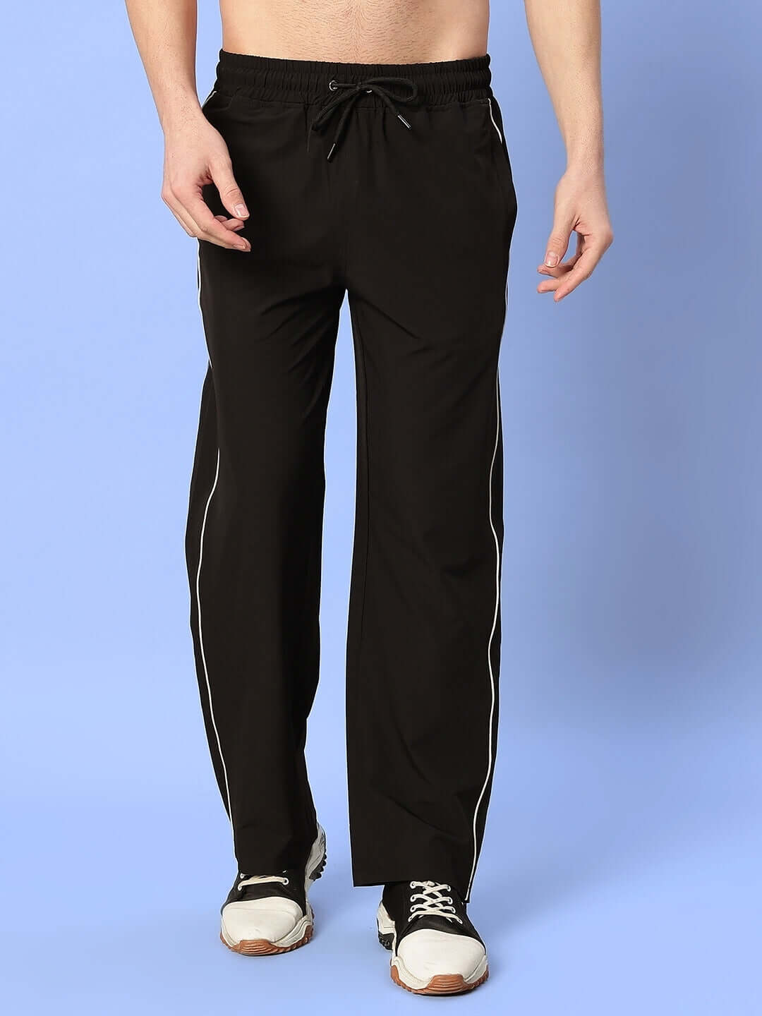 Model wearing RELIGHT Relaxed-Fit Joggers in Black, showcasing casual style with customizable size options for perfect fit.