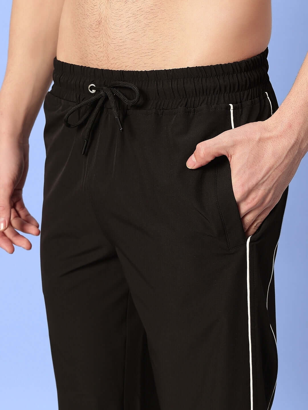 Model wearing black relaxed-fit joggers with drawstring waist and pocket detail, perfect for custom fit orders