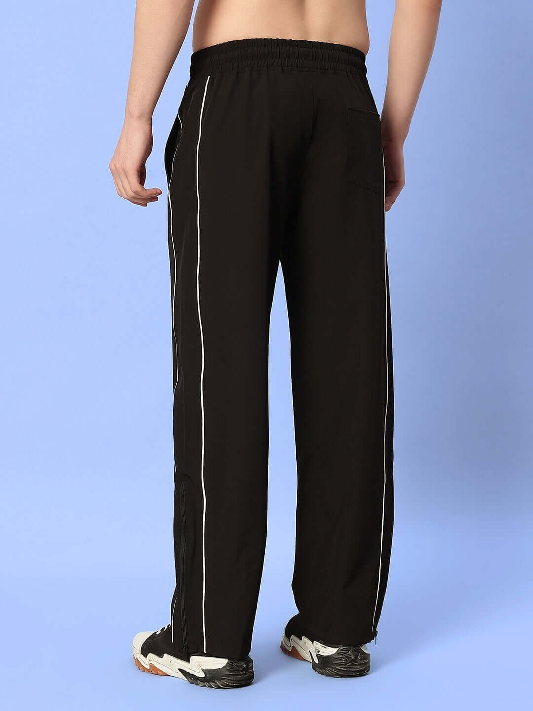 Back view of RELIGHT Relaxed-Fit Joggers in black featuring elastic waistband, for custom fit options and comfort. Ideal for casual wear.
