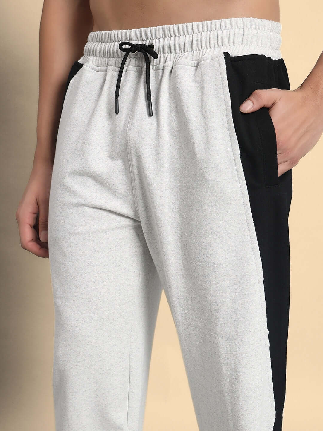 Model wearing REVIVE Side Contrast Joggers in Melange Grey-Black, showcasing quality tailoring by DUDS, available in custom fit.