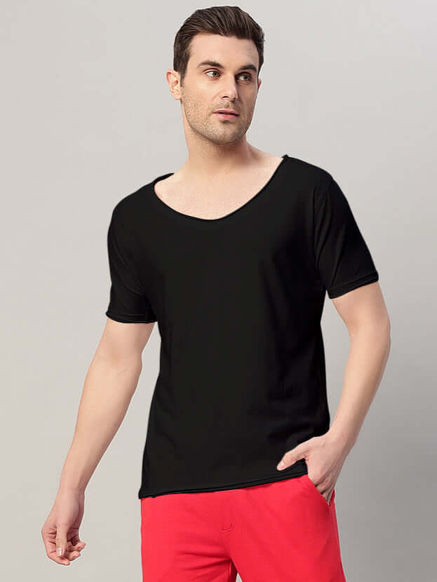 Man wearing Ricky Regular Fit T-Shirt Black made from soft cotton blend, showcasing relaxed fit and timeless style.