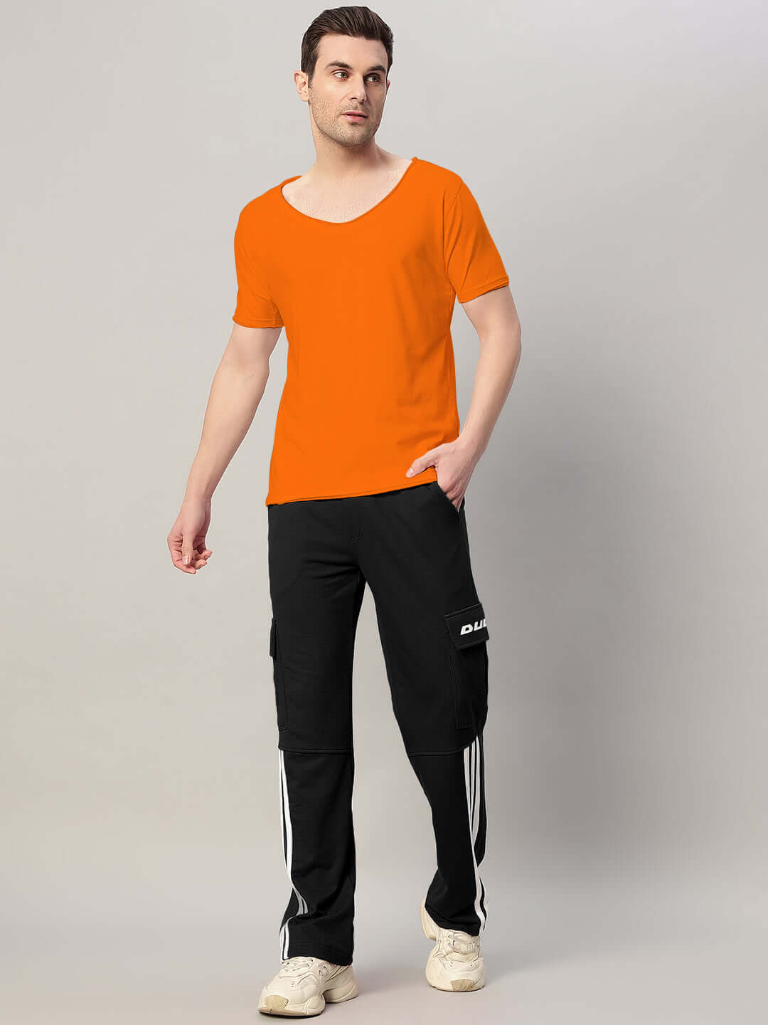Model wearing RICKY REGULAR FIT T-SHIRT ORANGE, showcasing vibrant style and comfort.