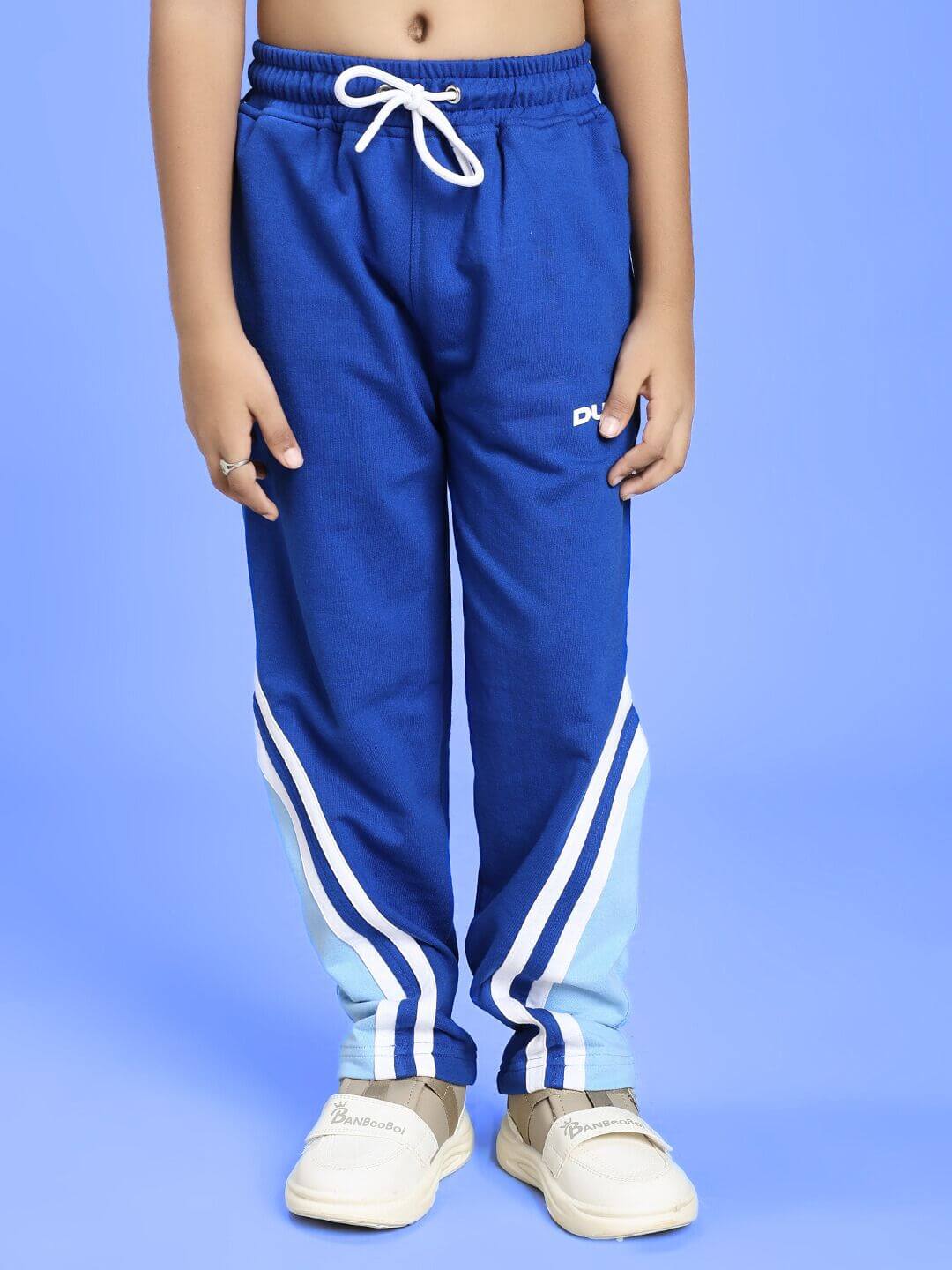 RIO ONE RELAXED FIT JOGGER FOR BOYS AND GIRLS BLUE, featuring comfortable and stylish design with white stripes.