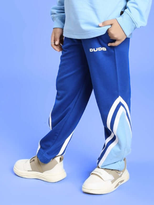 Child wearing RIO ONE RELAXED FIT JOGGER FOR BOYS AND GIRLS BLUE, showcasing cool casual style with comfortable fit and versatile design.