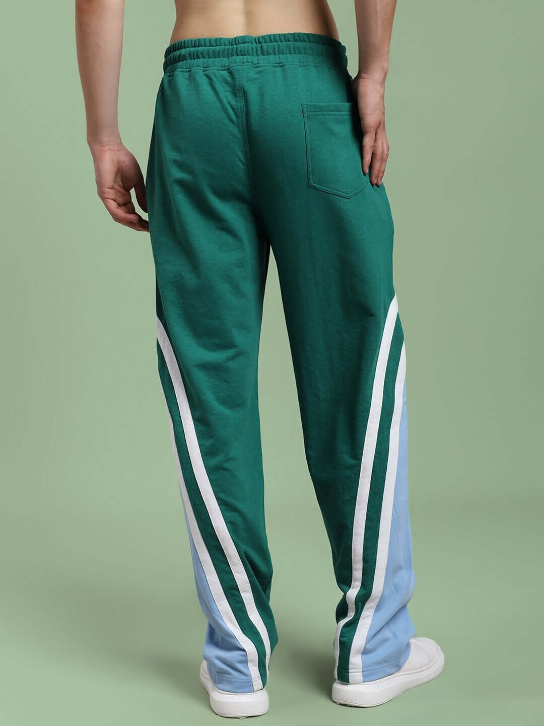 Rear view of person wearing RIO ONE RELAXED FIT JOGGERS TEAL GREEN showcasing streetwear style.
