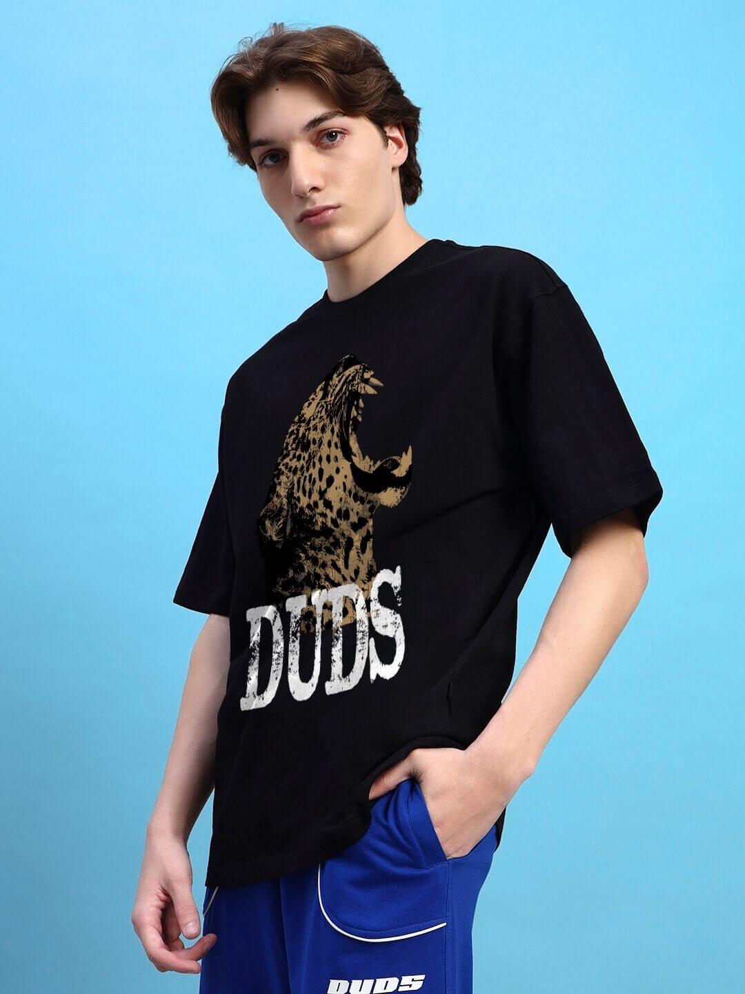 Model wearing ROARING THUNDER PRINTED OVERSIZED T-SHIRT BLACK with bold graphic print, streetwear fashion