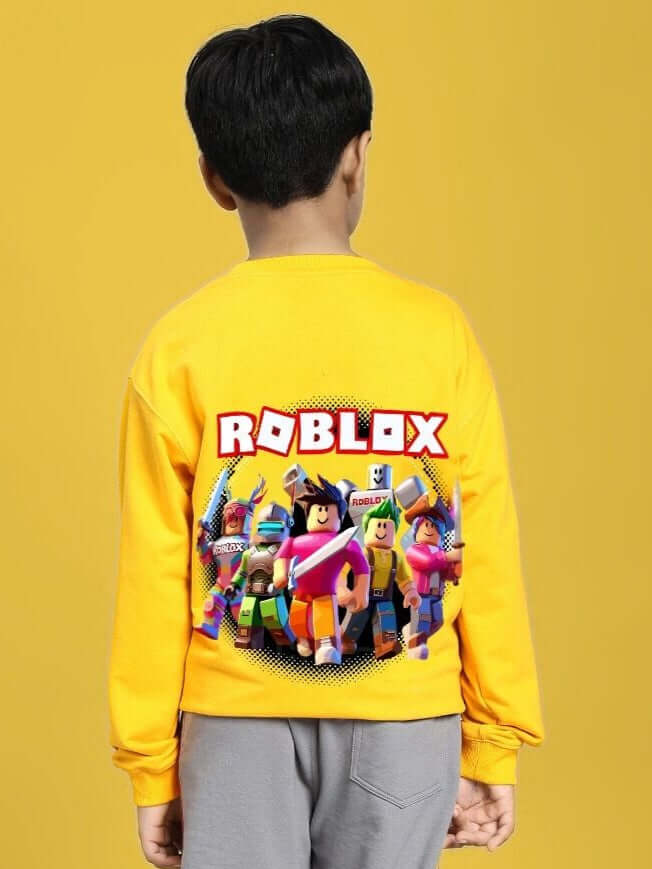 Child wearing ROBLOX SWEATSHIRT FOR BOYS AND GIRLS YELLOW with colorful characters on the back, gaming fashion style.