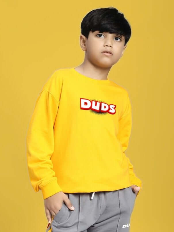 Kid wearing a ROBLOX SWEATSHIRT FOR BOYS AND GIRLS YELLOW showcasing a vibrant gaming-inspired design.