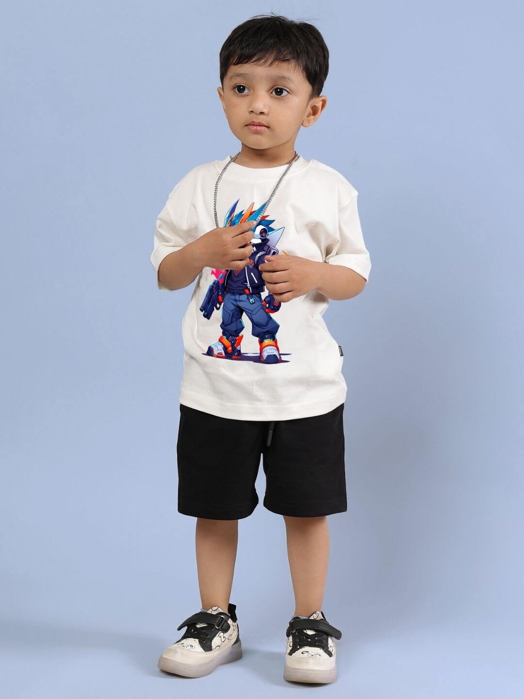 Child wearing Robo Super Co-ord Set in off white and black, featuring a printed T-shirt and black shorts. Trendy kids fashion outfit.