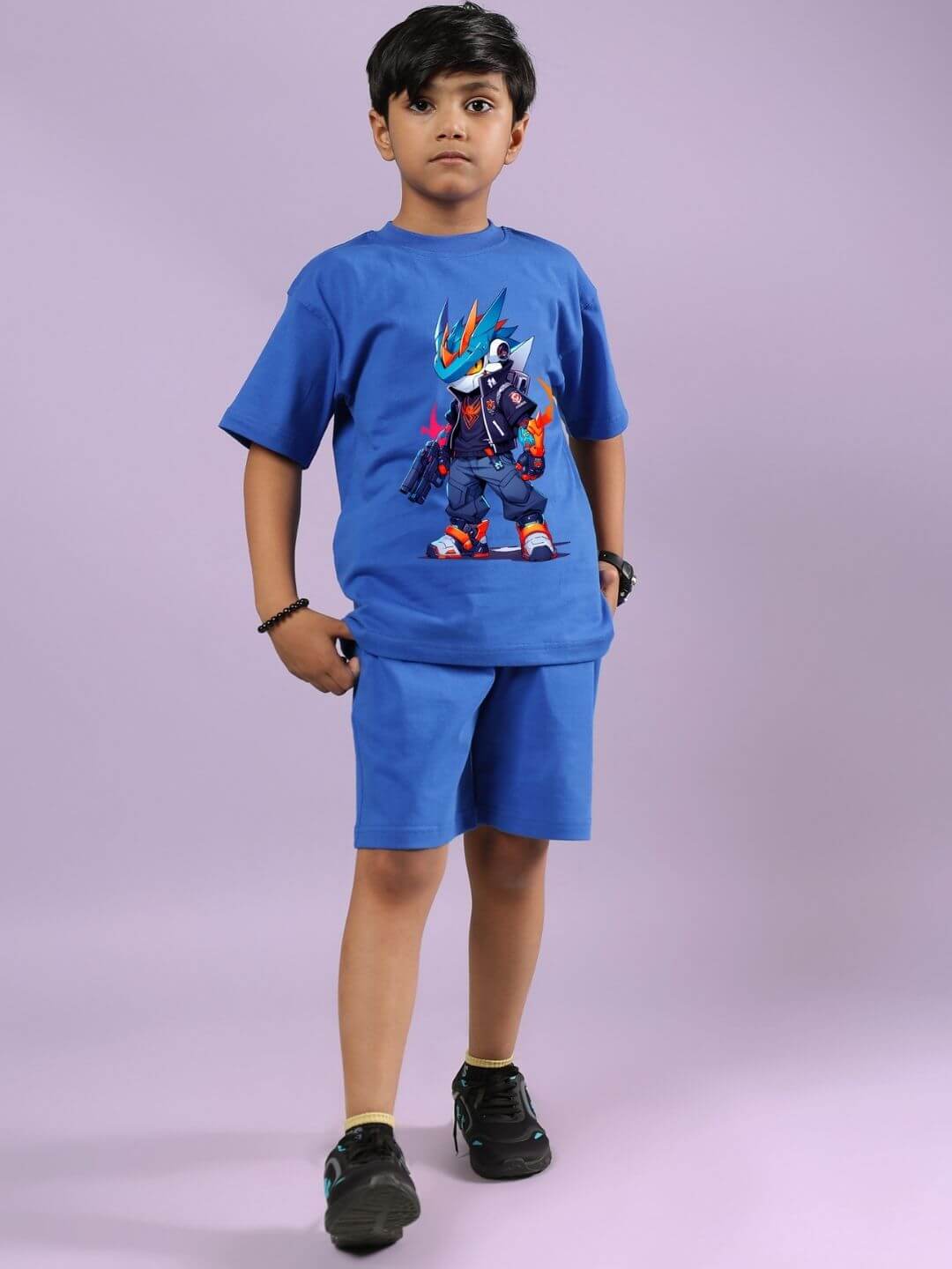 Child wearing blue Robo Super Co-ord Set with graphic T-shirt and matching shorts, designed for boys and girls.