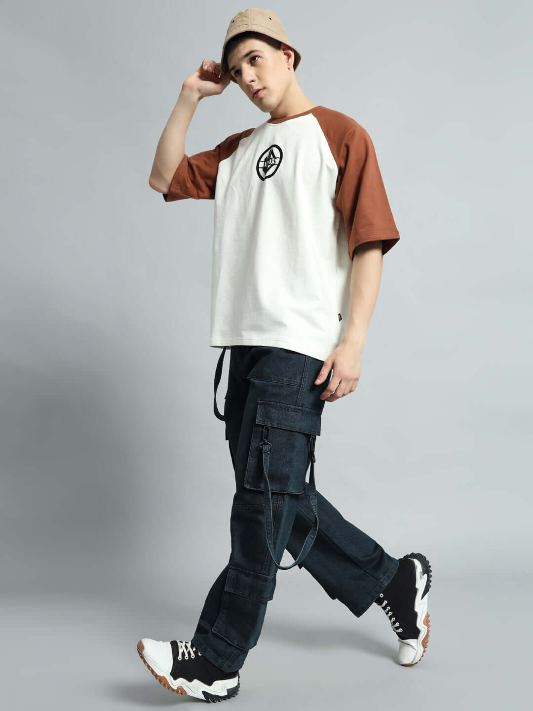 Model wearing Rockie Relaxed Denim Cargo Pants in blue, paired with a casual tee and sneakers.