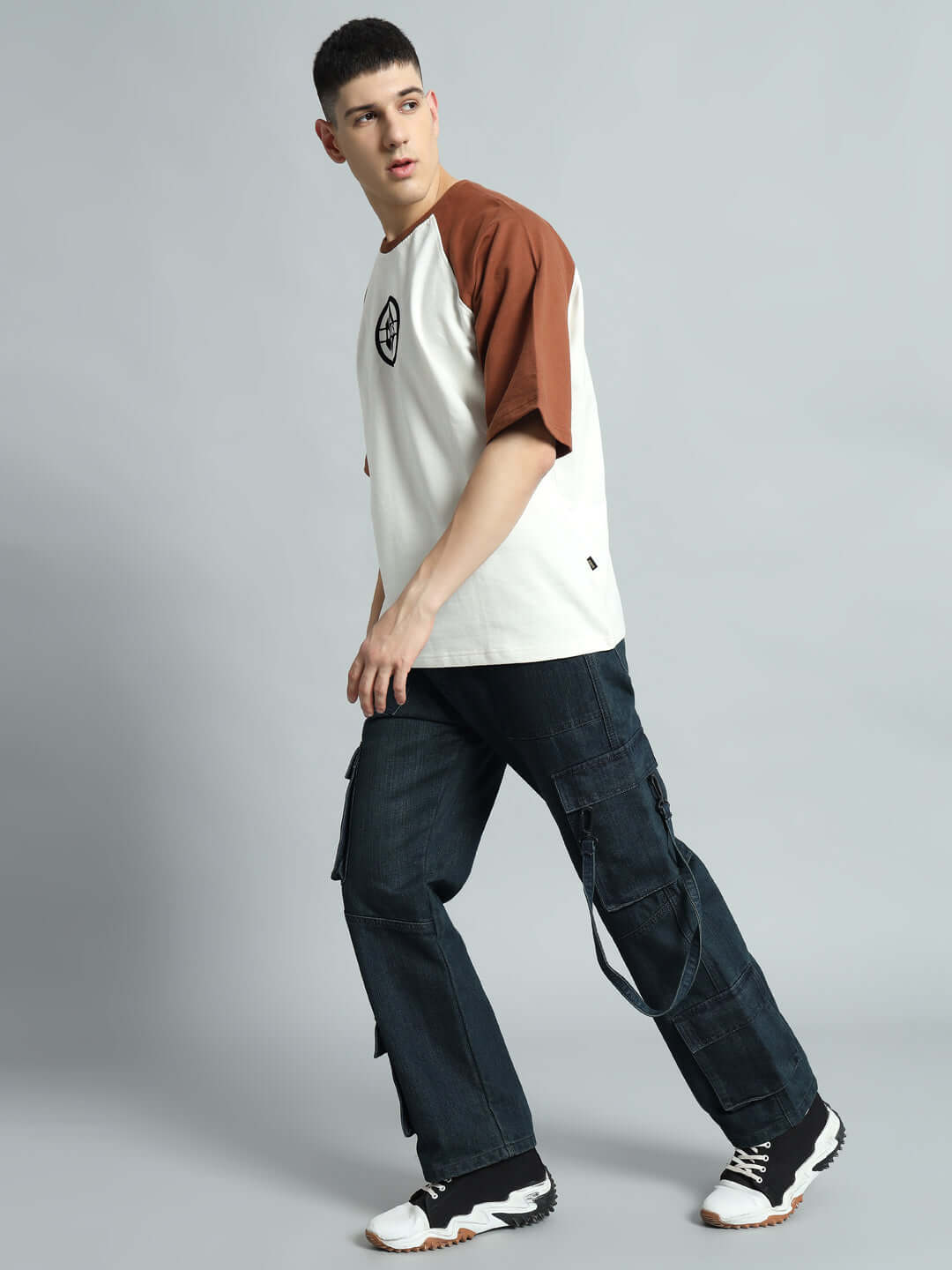 Man wearing Rockie Relaxed Denim Cargo blue jeans with a casual two-tone shirt