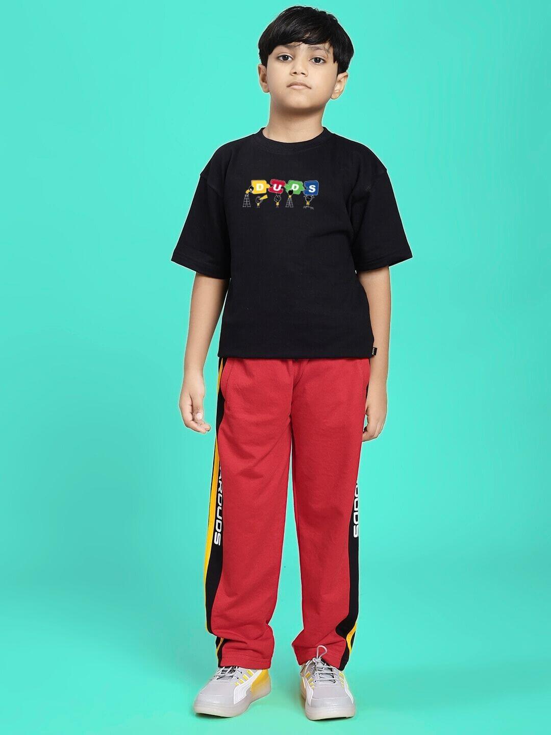 Boy wearing ROGER RELAXED-FIT JOGGER FOR BOYS AND GIRLS RED BLACK with a black t-shirt against a teal background.