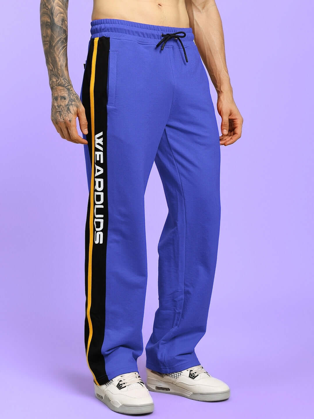 Person wearing ROGER RELAXED-FIT JOGGERS BLUE, showcasing modern streetwear style for versatile everyday comfort.