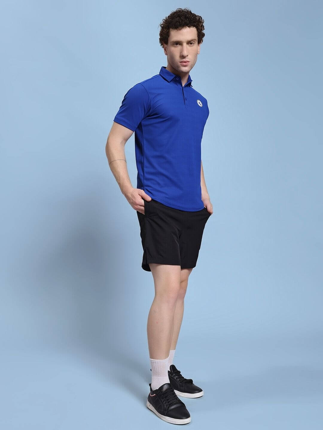 Model wearing ROSEWOOD CO-ORD SET BLUE BLACK, showcasing stylish streetwear design with bold color blocking and sleek silhouette.