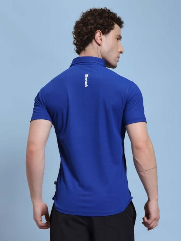 Back view of ROSEWOOD POLO REGULAR FIT T-SHIRT BLUE worn by a model, showcasing the shirt's fit and design.