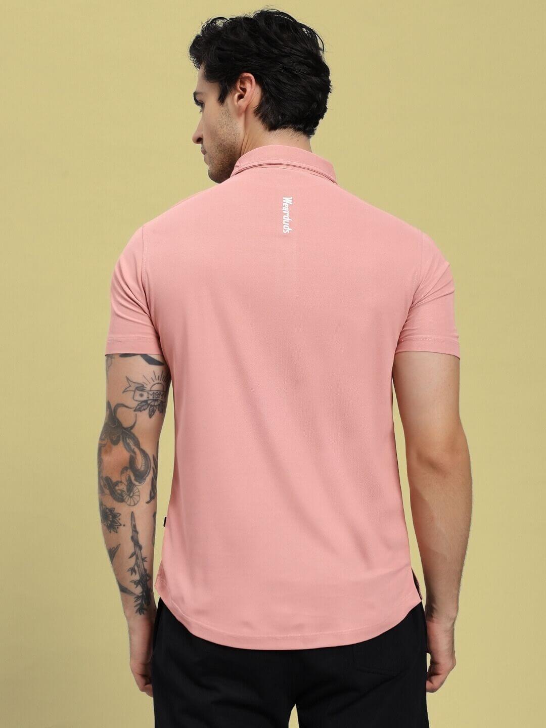 Back view of model wearing ROSEWOOD POLO REGULAR FIT T-SHIRT PINK, showcasing design and comfort.