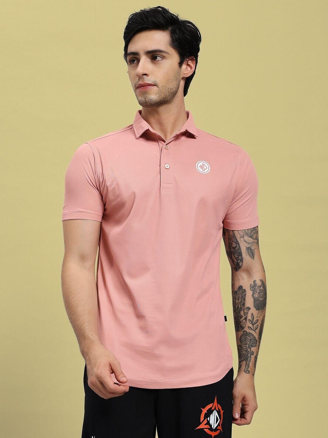 Man wearing ROSEWOOD POLO REGULAR FIT T-SHIRT PINK, showcasing its style and comfort in a casual setting.