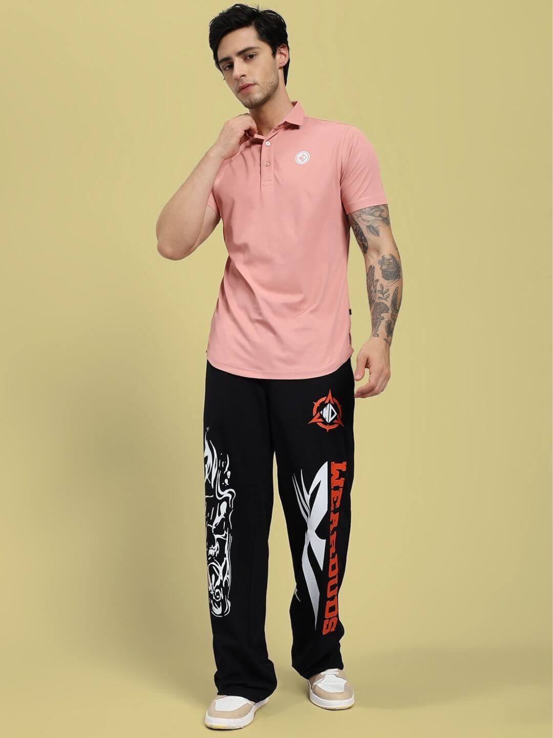 Man wearing ROSEWOOD POLO REGULAR FIT T-SHIRT PINK paired with black graphic pants