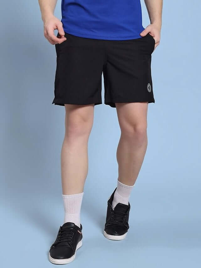 Person wearing ROSEWOOD RELAXED FIT SHORTS BLACK showcasing relaxed silhouette and modern style, perfect for streetwear and comfort.