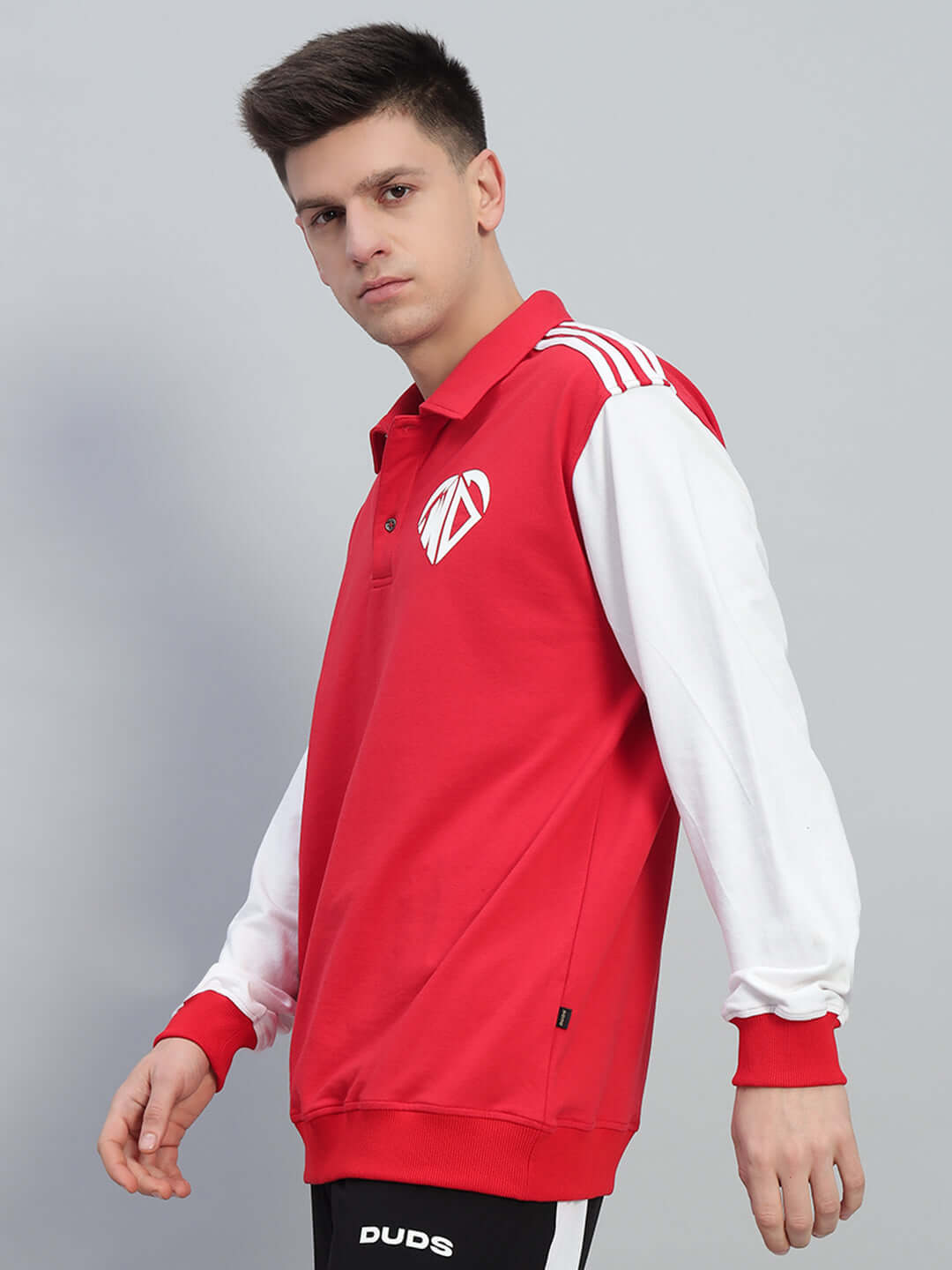 Man wearing Rowan oversized red-white sweatshirt made of premium cotton fabric.