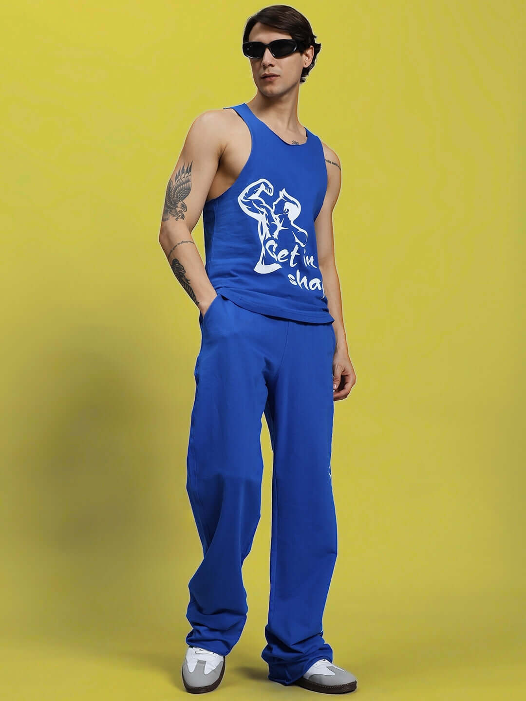 Model wearing GET IN SHAPE GYM T-SHIRT ROYAL BLUE, perfect for fitness enthusiasts and workout motivation.
