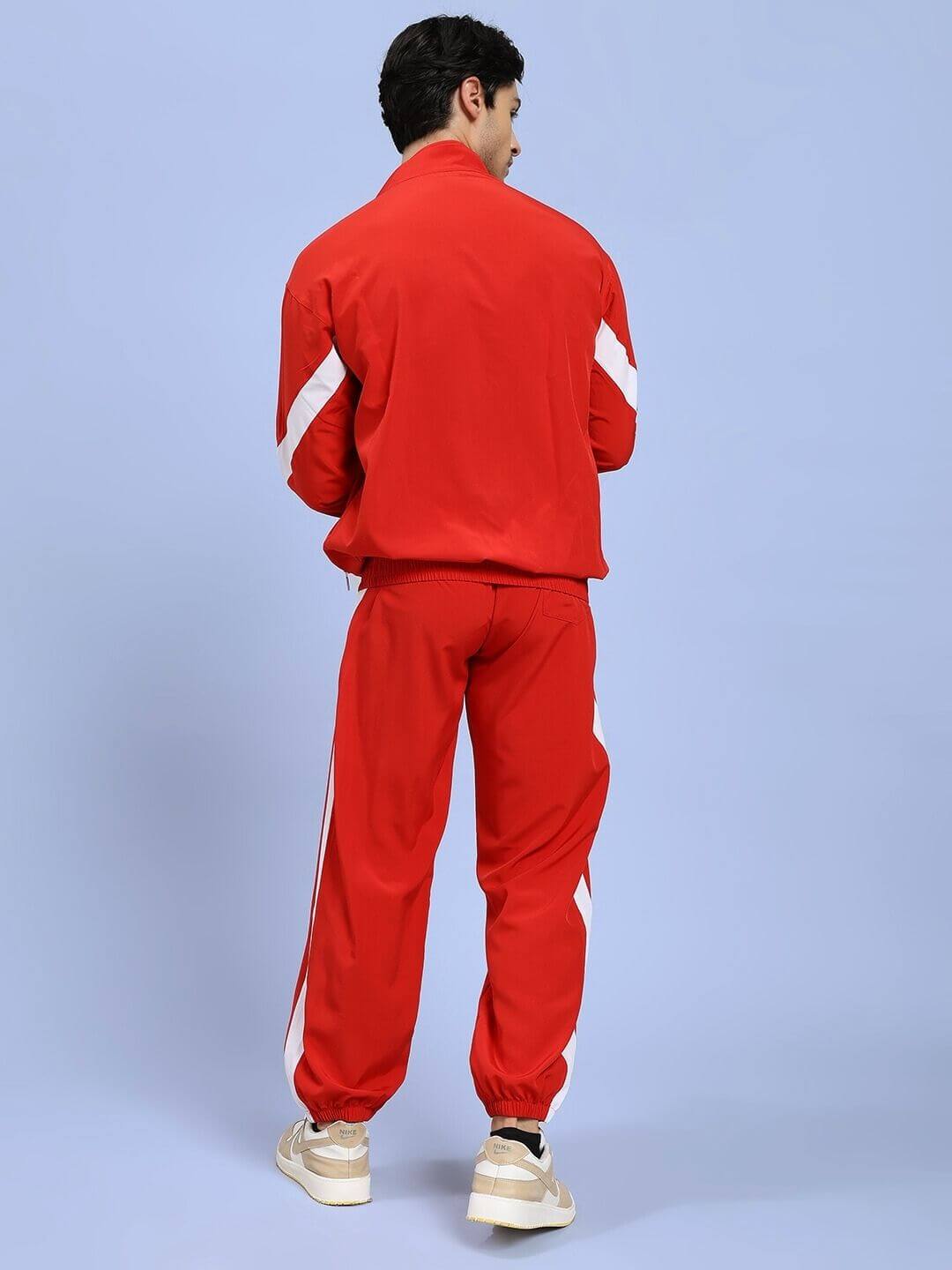 Person wearing ROYAL COMFORT RELAXED FIT CO-ORD SET RED, showcasing the luxury and elegance of the red co-ord ensemble from behind.