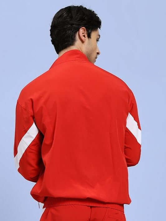 Back view of a person wearing ROYAL COMFORT RELAXED FIT JACKET RED with white accents, showcasing casual and elegant style.