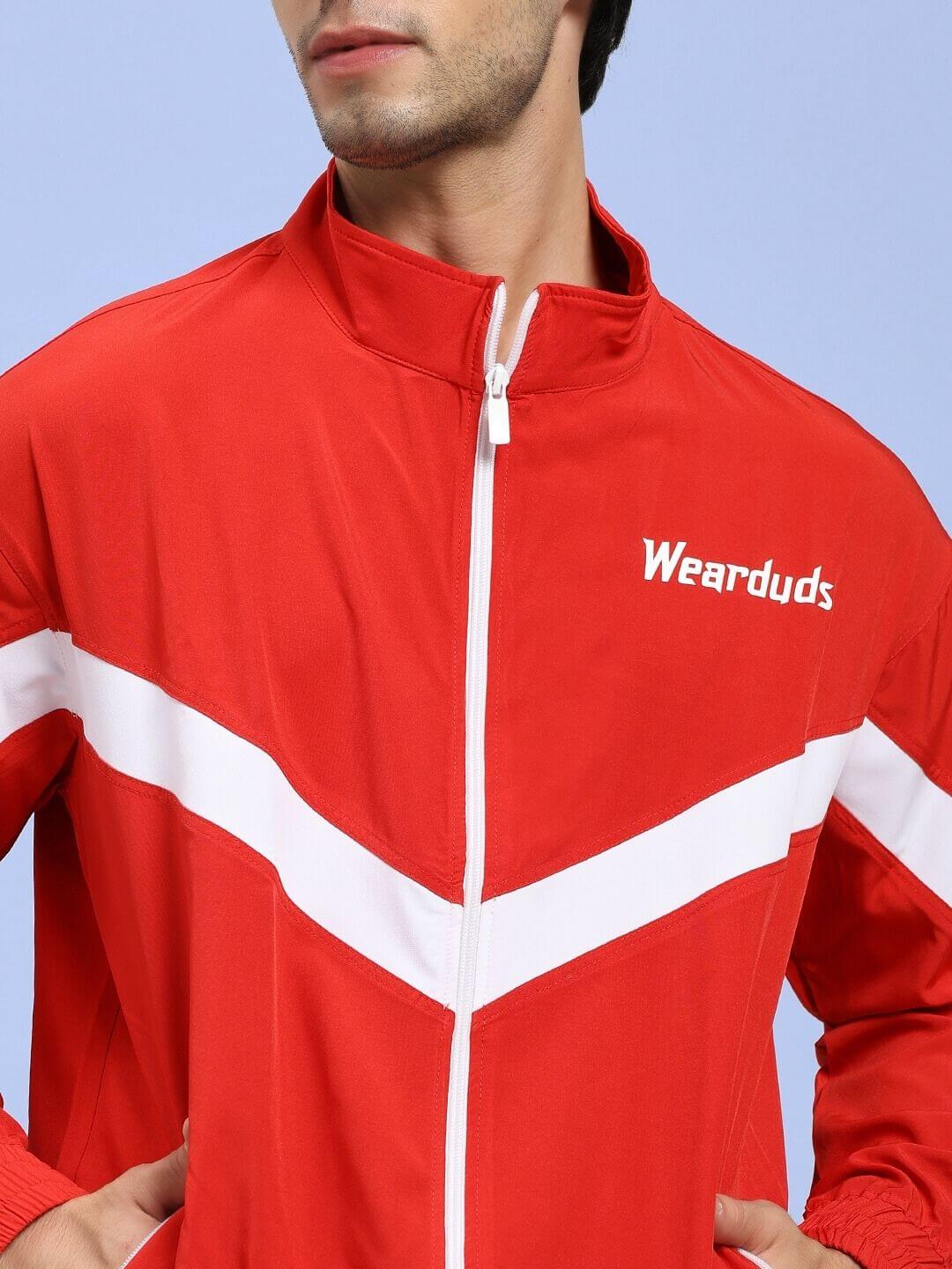 Person wearing the Royal Comfort Relaxed Fit Jacket Red with a zipper and white stripe accents.