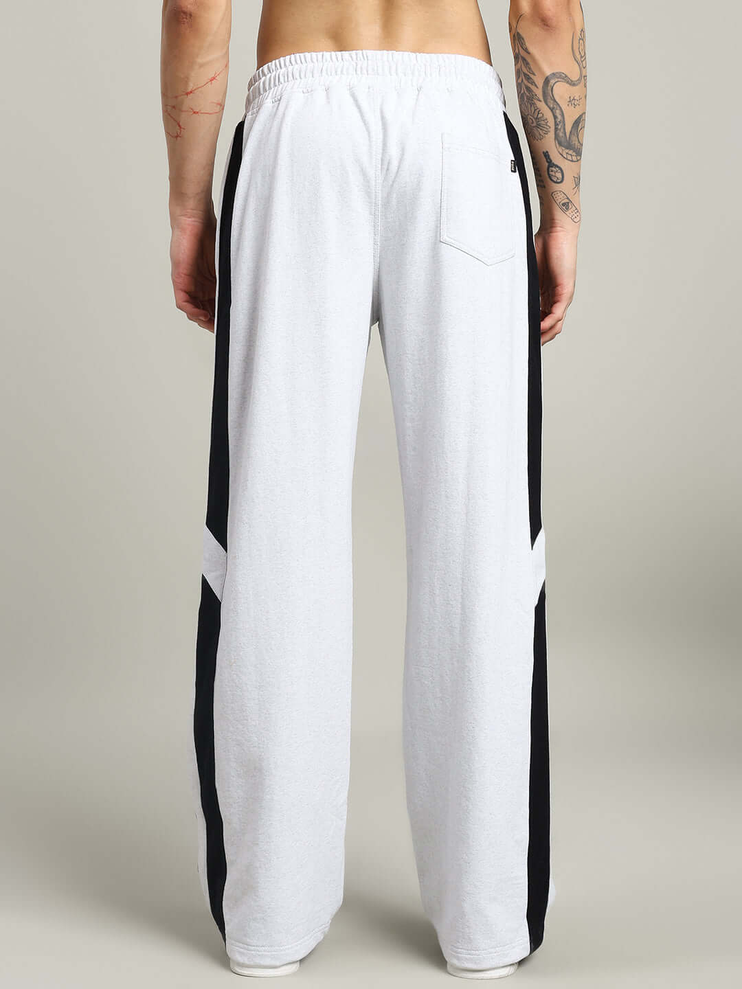 Back view of ROYALSON COTTON JOGGERS MELANGE-GREY highlighting contrast panel details and luxurious cotton terry fabric.