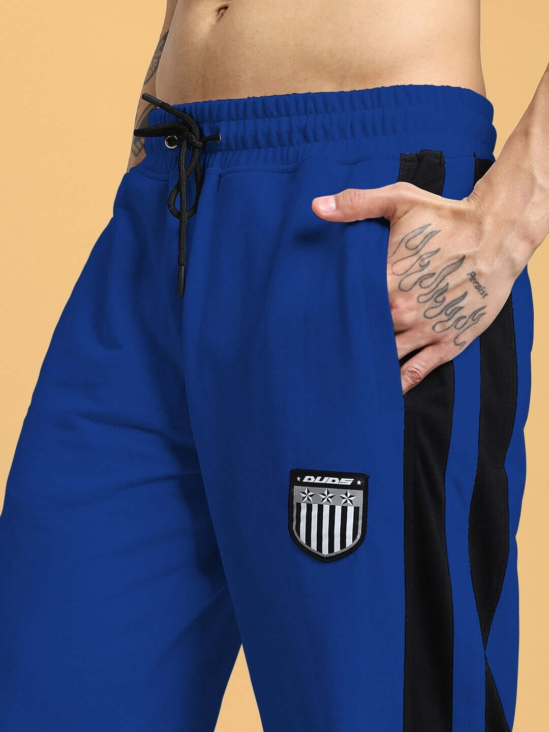 ROYALSON PREMIUM JOGGERS IN BLUE showing side pocket and embroidered patch
