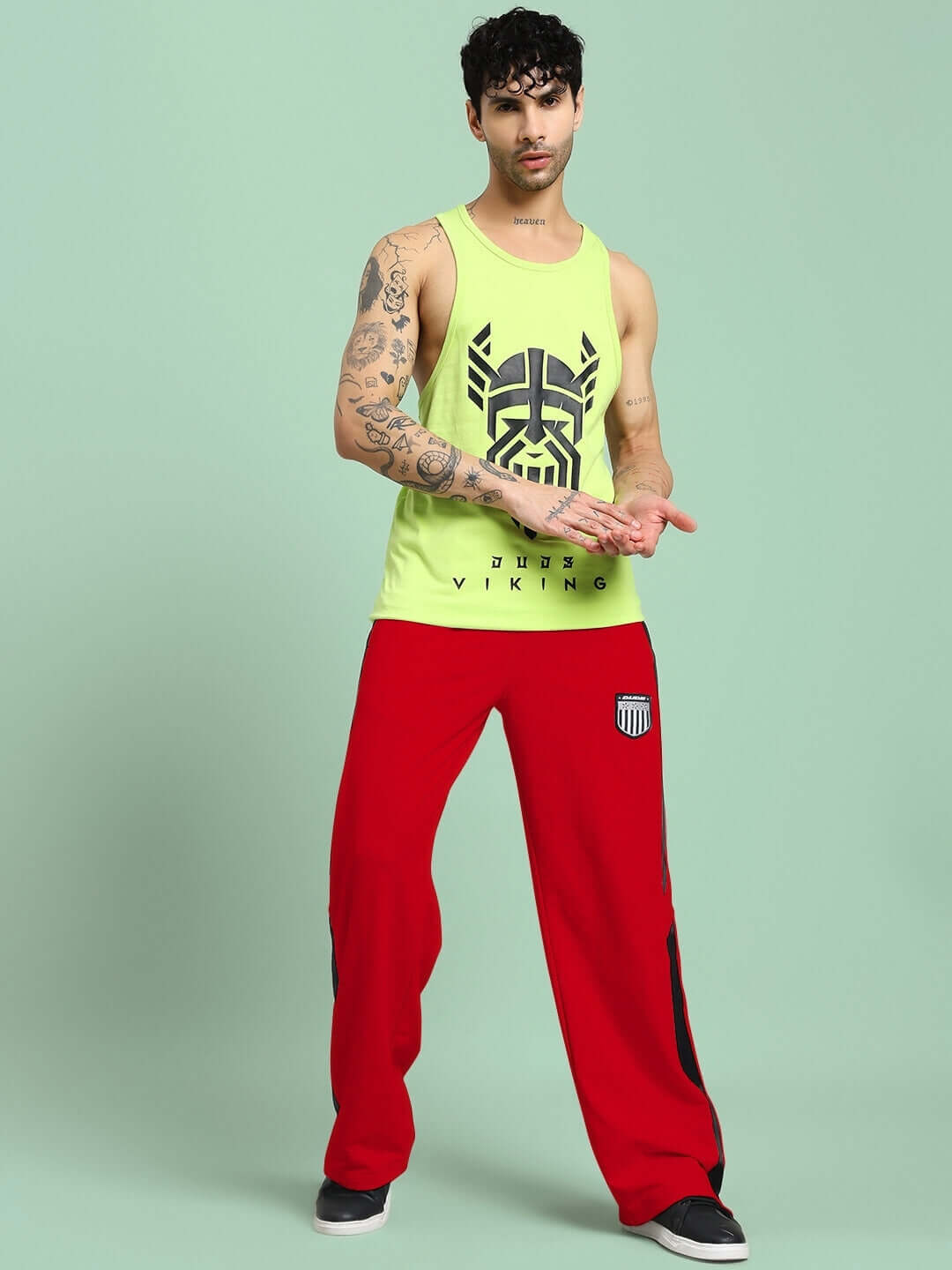Model wearing ROYALSON PREMIUM JOGGERS IN RED showcasing stylish activewear for a bold and confident look.