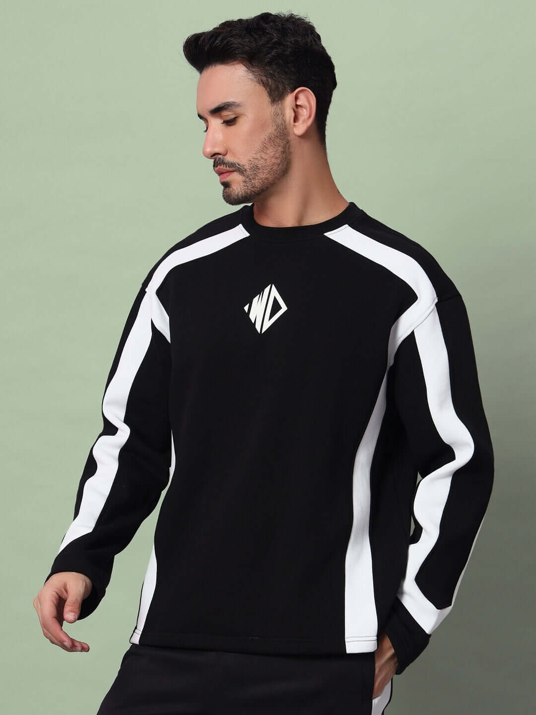 Model wearing RUGBY OVERSIZED FLEECE SWEATSHIRT BLACK with athletic stripes, showcasing relaxed fit and vintage rugby style.