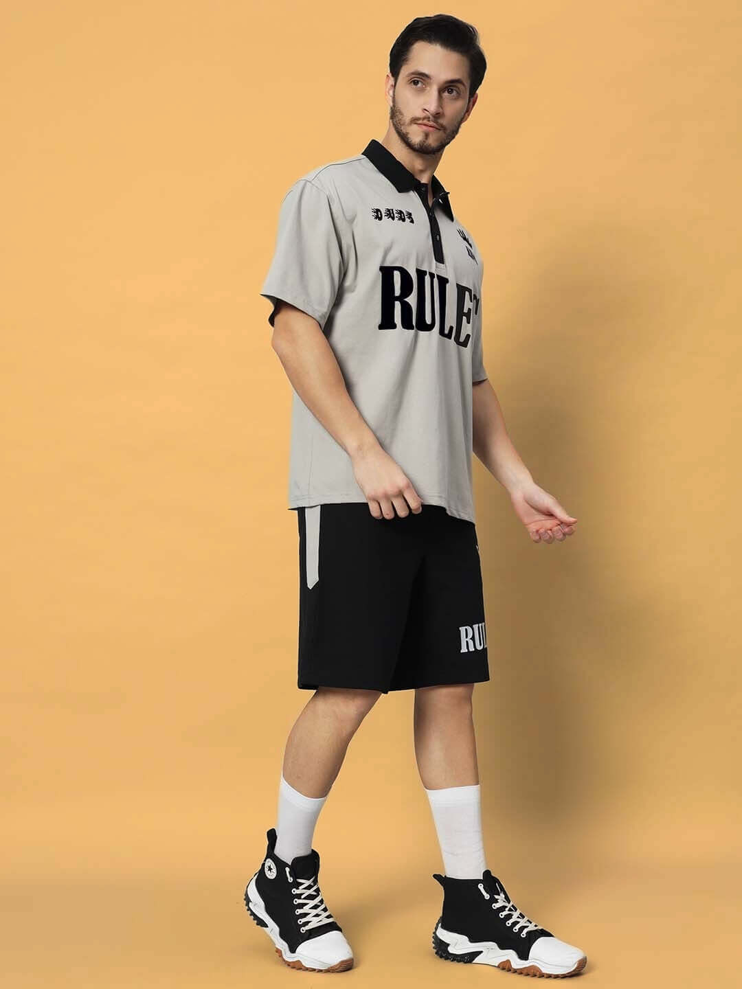 Model wearing grey-black RULES KING co-ord set made of premium cotton French terry lycra, showcasing stylish design and comfort.