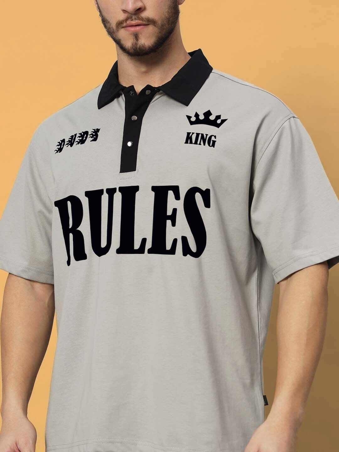 Model wearing RULES KING grey-black co-ord set, premium cotton French terry fabric, displaying 'RULES' and 'KING' text design.