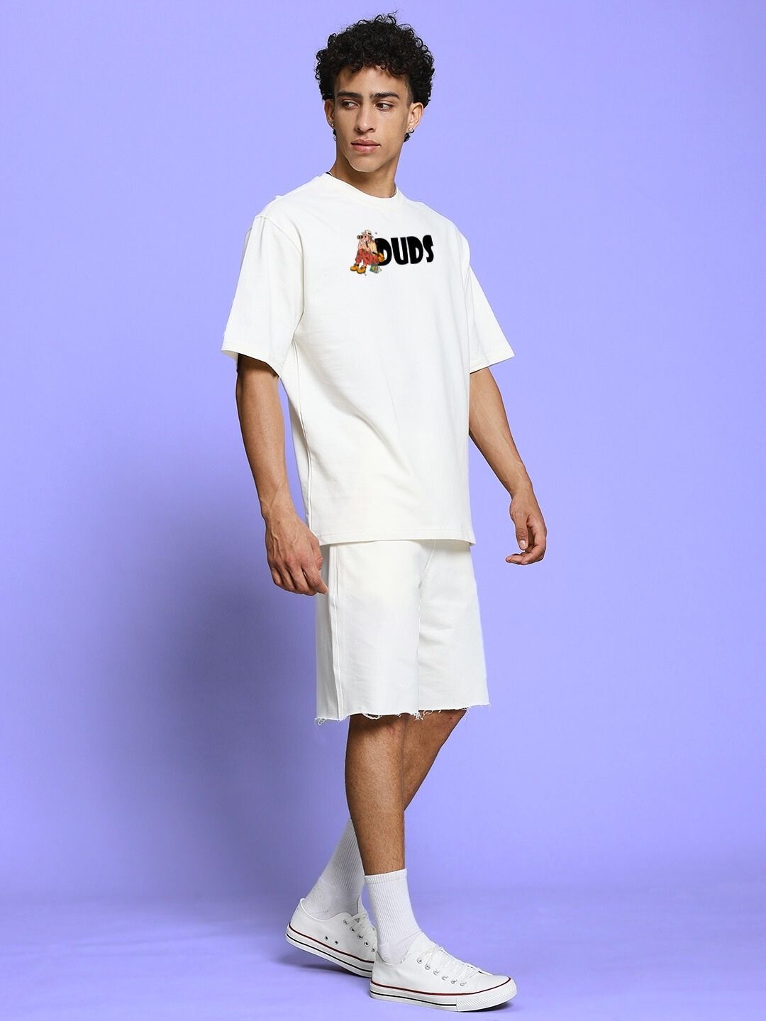 Men's model wearing SAFARI PRINTED CO-ORD SET OFF-WHITE with safari-inspired prints, relaxed oversized tee and matching shorts.