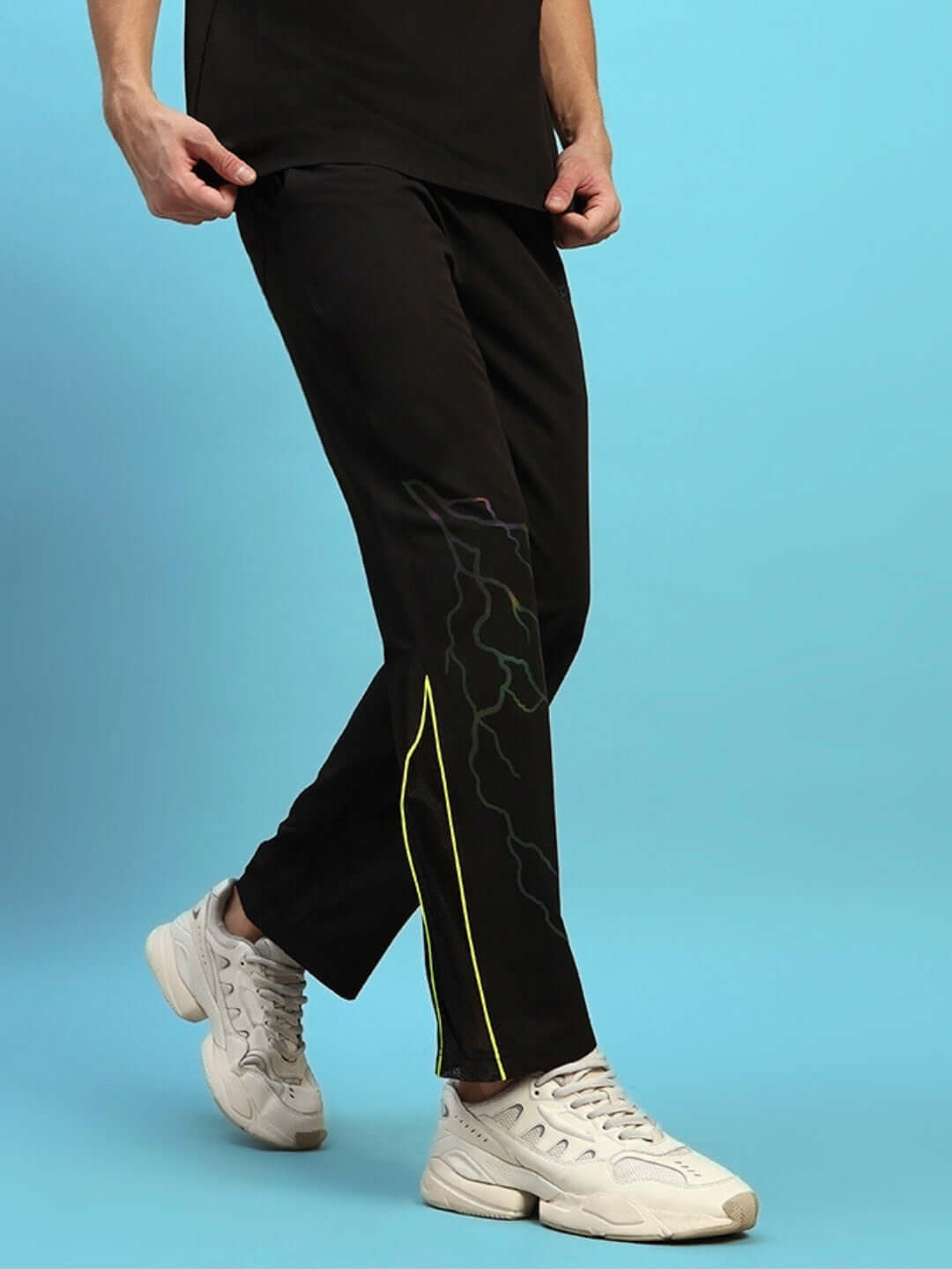 SALVO REFLECTOR RELAXED-FIT JOGGERS BLACK worn by model against blue background