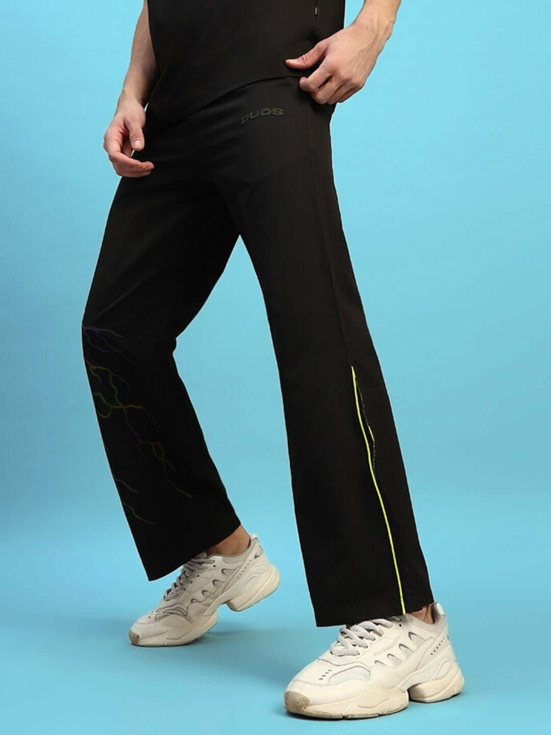 SALVO REFLECTOR RELAXED-FIT JOGGERS BLACK displayed on a model with white sneakers, showcasing design and fit features.
