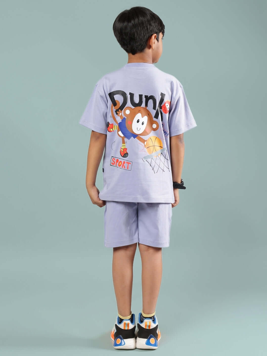 Child wearing SAMMY CO-ORD FOR BOYS & GIRLS LAVENDER outfit featuring cartoon graphics on back, showcasing fun style and comfort.