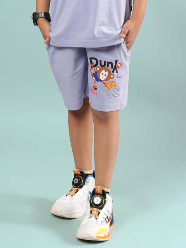 SAMMY SHORTS FOR BOYS & GIRLS LAVENDER worn by a child, featuring fun basketball print.