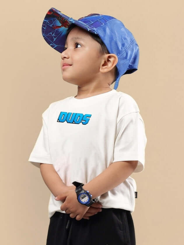 Child wearing Samurai oversized t-shirt for boys & girls off white, paired with a blue cap and watch, showcasing DUDS brand clothing.