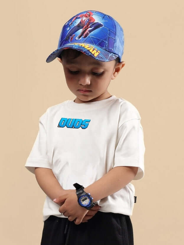 Young child wearing SAMURAI OVERSIZED T-SHIRT FOR BOYS & GIRLS OFF WHITE with a colorful cap and digital watch.