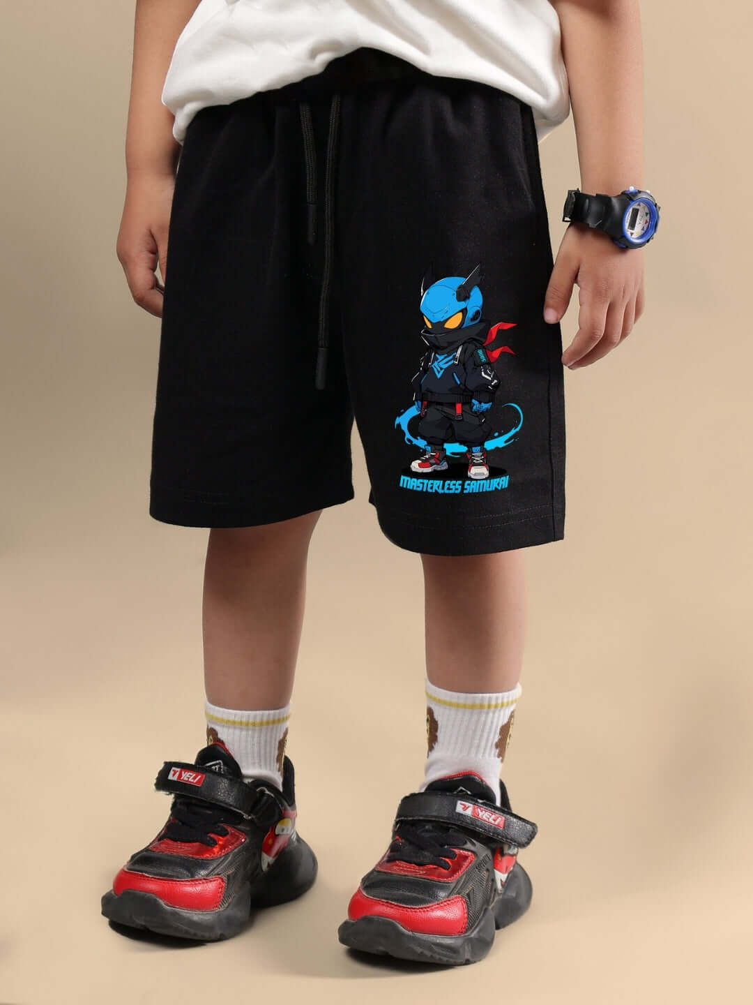 Child wearing SAMURAI PRINTED CO-ORD FOR BOYS & GIRLS OFF WHITE BLACK with colorful samurai design on shorts.