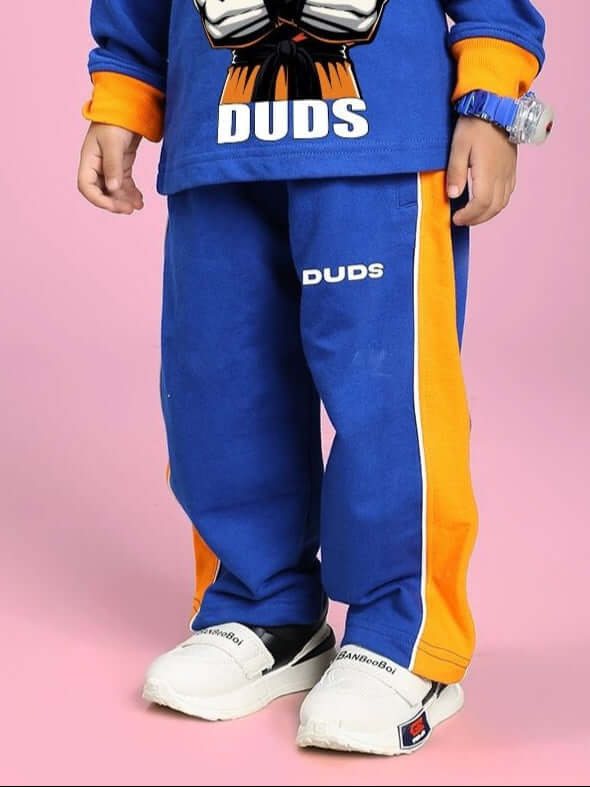 Child wearing Sanford Stripe Jogger for Boys and Girls Blue with bold stripes, showcasing stylish and comfortable design.