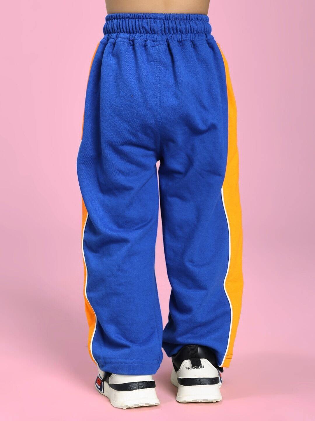 SANFORD STRIPE JOGGER FOR BOYS AND GIRLS BLUE with bold stripe detail, back view on pink background.